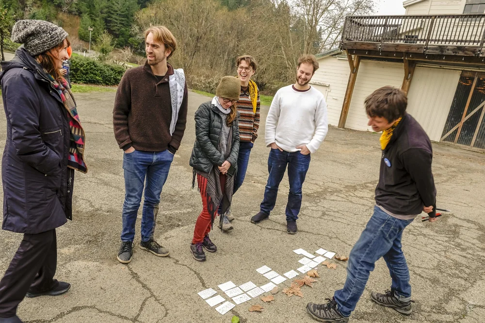 Participants standing together outside the farmhouse
