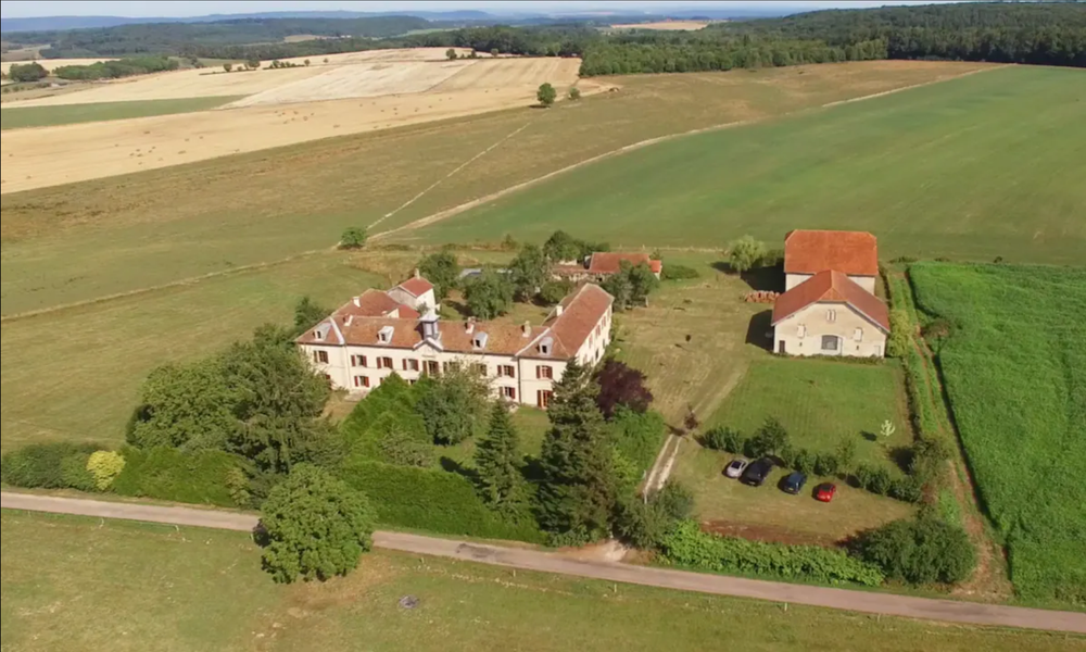 Aerial view of Château de Gressoux among fields