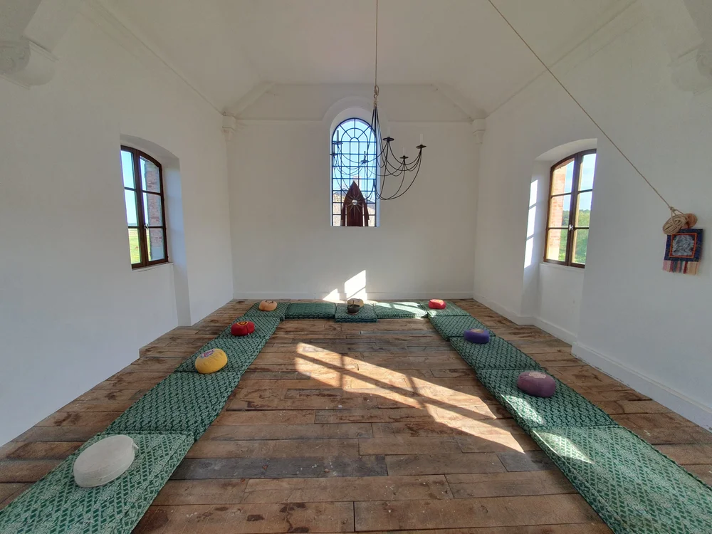 The meditation chapel with cushions on the floor