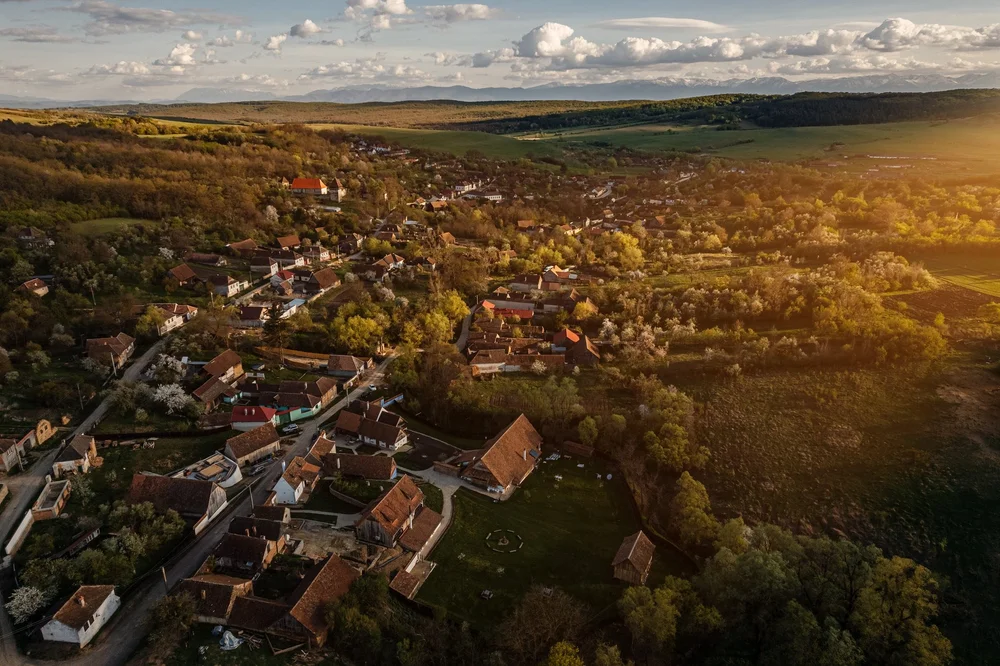 Aerial view of the village of Cobor among green hills